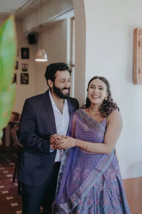 Engaged couple laughing together