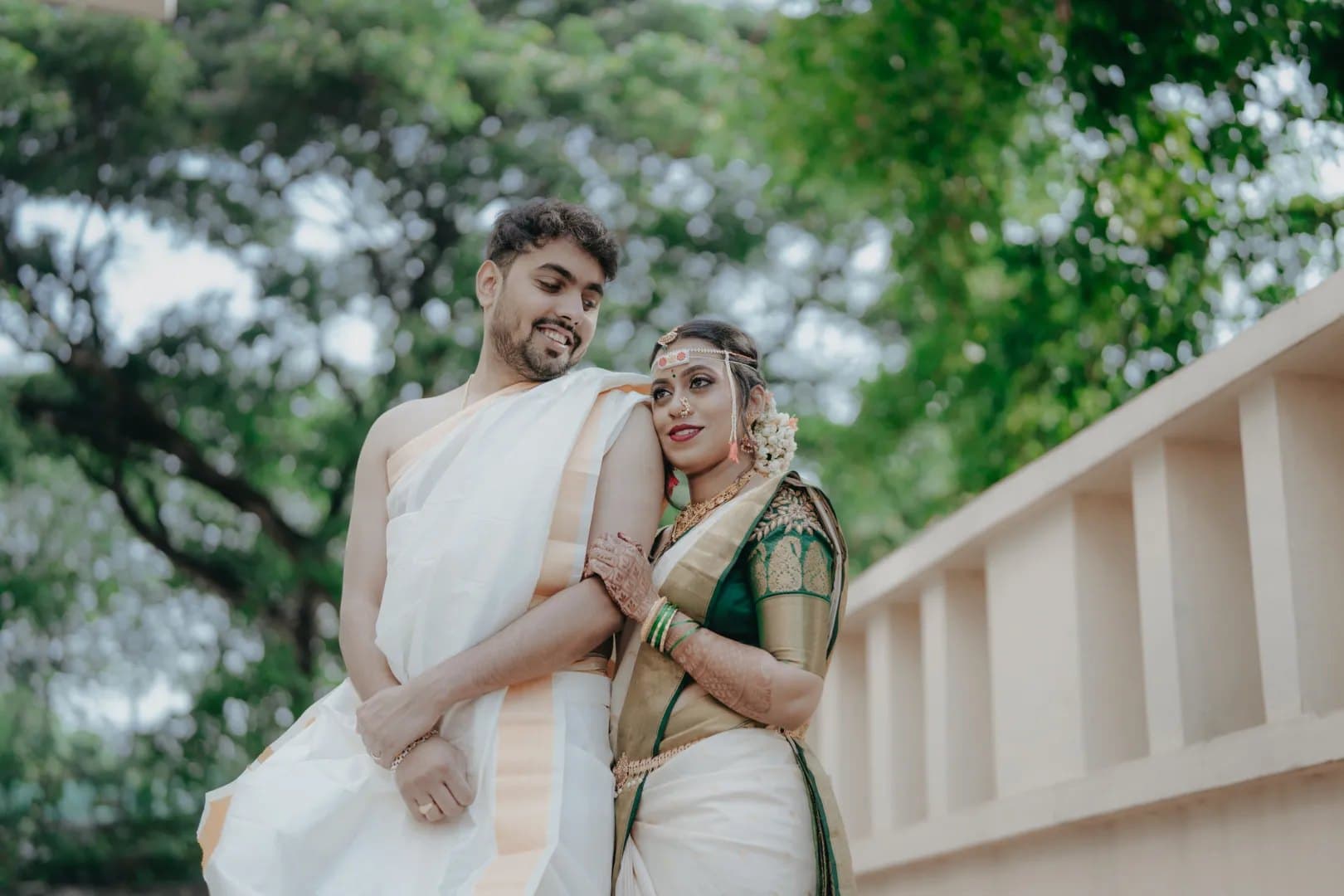 Bride in green and gold silk saree